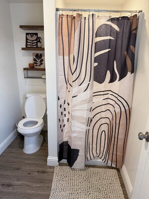 Shower, towels, soap, toilet paper
