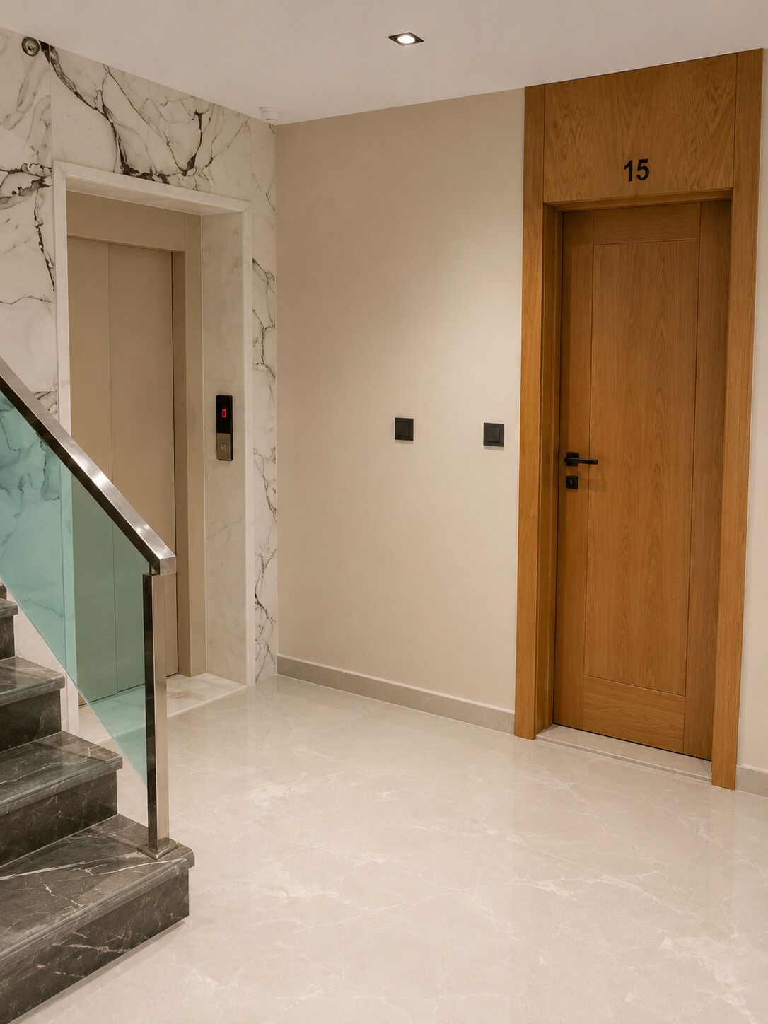 A hallway with a marble wall, a wooden door labeled '15', and a glass staircase.