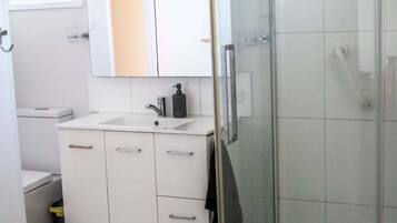 Shower, hair dryer, towels, soap