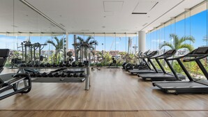 A gym with treadmills, dumbbells, and exercise equipment. - Luxury in Marina Vallarta Gym Roof Pool (Puerto Vallarta)