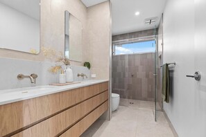 Shower, hair dryer, towels, shampoo