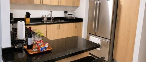 Coffee/tea maker, fridge, microwave, oven