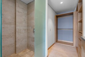 A bathroom with a shower, a toilet, and a sink. - 1BR, 2BA condo in Marina Vallarta, Puerto Vallarta. (Puerto Vallarta)