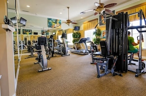 A gym with various exercise equipment, including treadmills and weight machines. - DisneyMagic!Luxury Getaway (Davenport)
