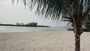 On the beach, sun loungers, beach towels