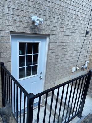A white door with a window, a brick wall, and a black metal railing. - Entire home in Brampton, Canada
2 guests1 bedroom1 bed1 bath (Brampton)
