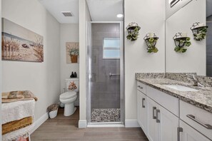 Shower, hair dryer, towels, shampoo