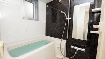 Superior Apartment (603) | Bathroom | Separate tub and shower, hair dryer, towels, shampoo