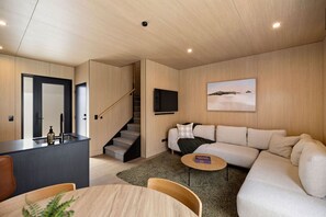 A modern interior with a kitchen, dining area, and living room. - Prime Location, best value in Queenstown (Queenstown)