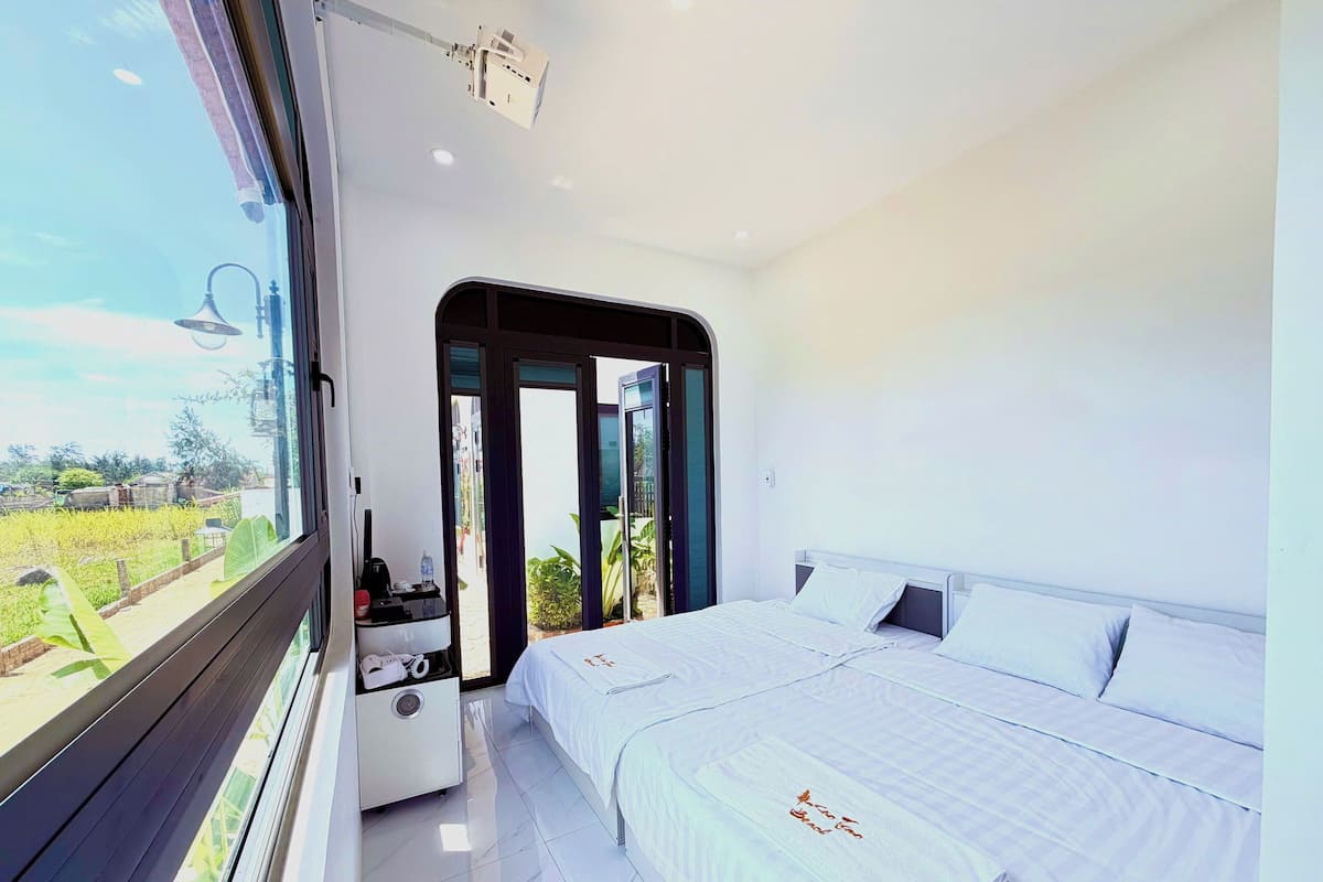 Luxury Triple Room, Patio, Courtyard View | Desk, iron/ironing board, WiFi (free), bed sheets