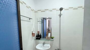 Superior Quadruple Room, City View | Bathroom | Shower, rainfall showerhead, designer toiletries, hair dryer