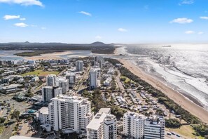 A coastal cityscape with high-rise buildings, a beach, and a river. - Sakara @Maroochydore (Maroochydore)