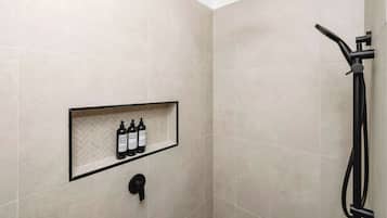 Shower, hair dryer, towels, shampoo