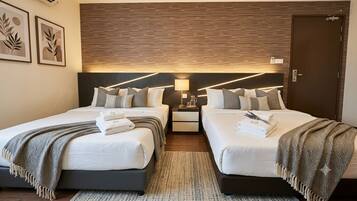 Economy Room | Desk, laptop workspace, WiFi (free), bed sheets