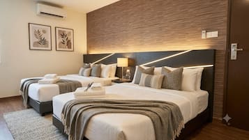 Economy Room | Desk, laptop workspace, WiFi (free), bed sheets
