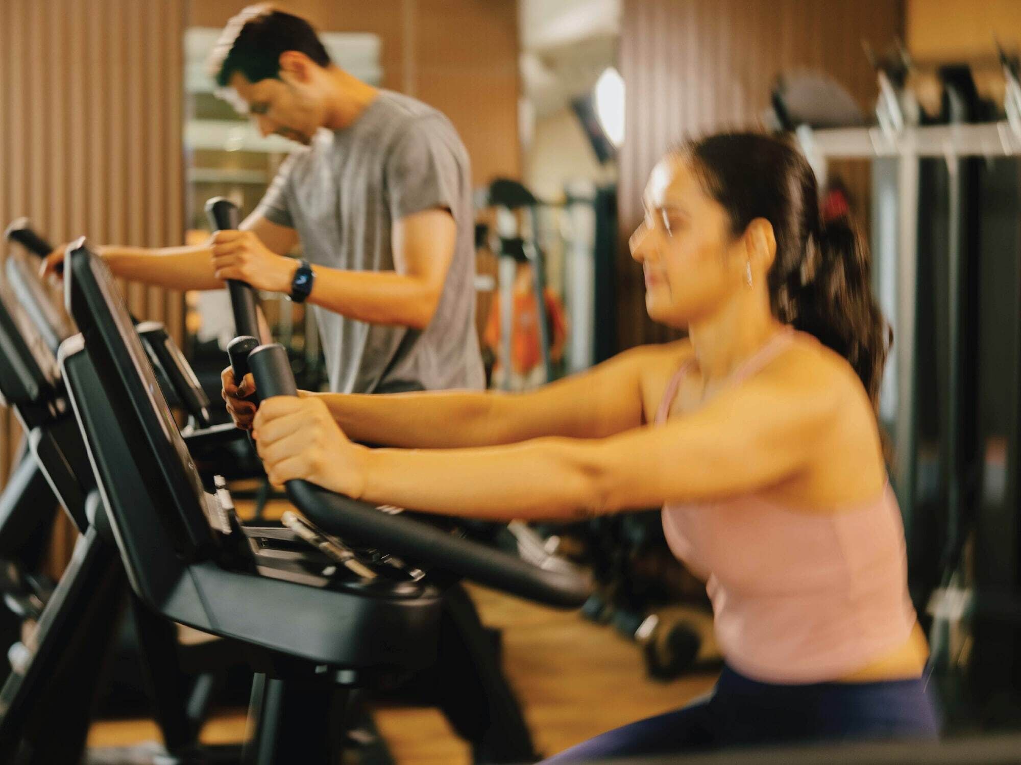 A gym with stationary bikes and weight machines.