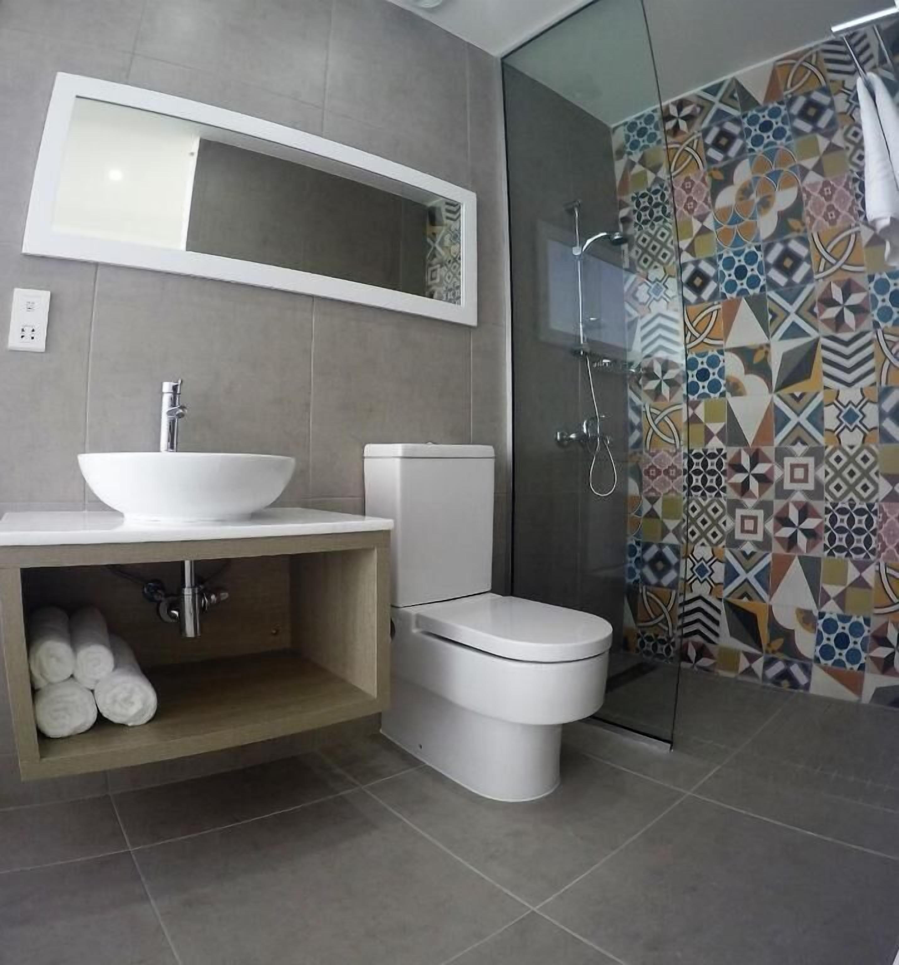 Shower, free toiletries, hair dryer, slippers