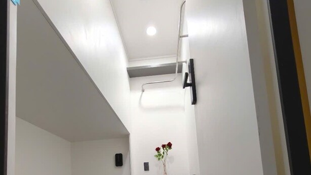 A narrow corridor with a bunk bed on the left and a door on the right. - MM HOUSE - METRO Q1 (Ho Chi Minh City)