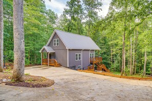 A house with a porch, a staircase, and a deck. - Cabin Retreat w/ Hot Tub Near Downtown Helen! (Helen)
