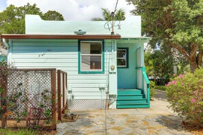 A small, single-story house with a front door and a small porch. - Walk to Lakeworth Dtwn! 5-Min Drive to Beach (Lake Worth Beach)