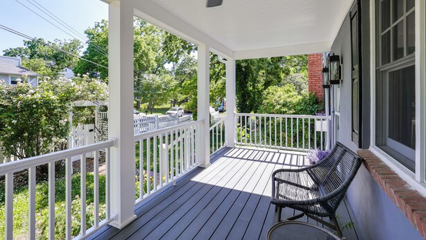 A covered porch with a ceiling fan, white railings, a bench, and a view of a residential area with trees and a parked car. - Waterfront Gem w/ Dock: 2 Mi to Dwtn Annapolis! (Annapolis)