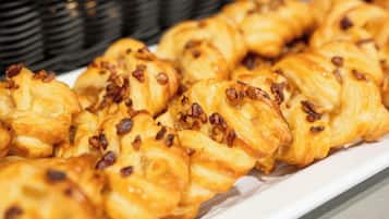 A variety of pastries displayed in baskets.