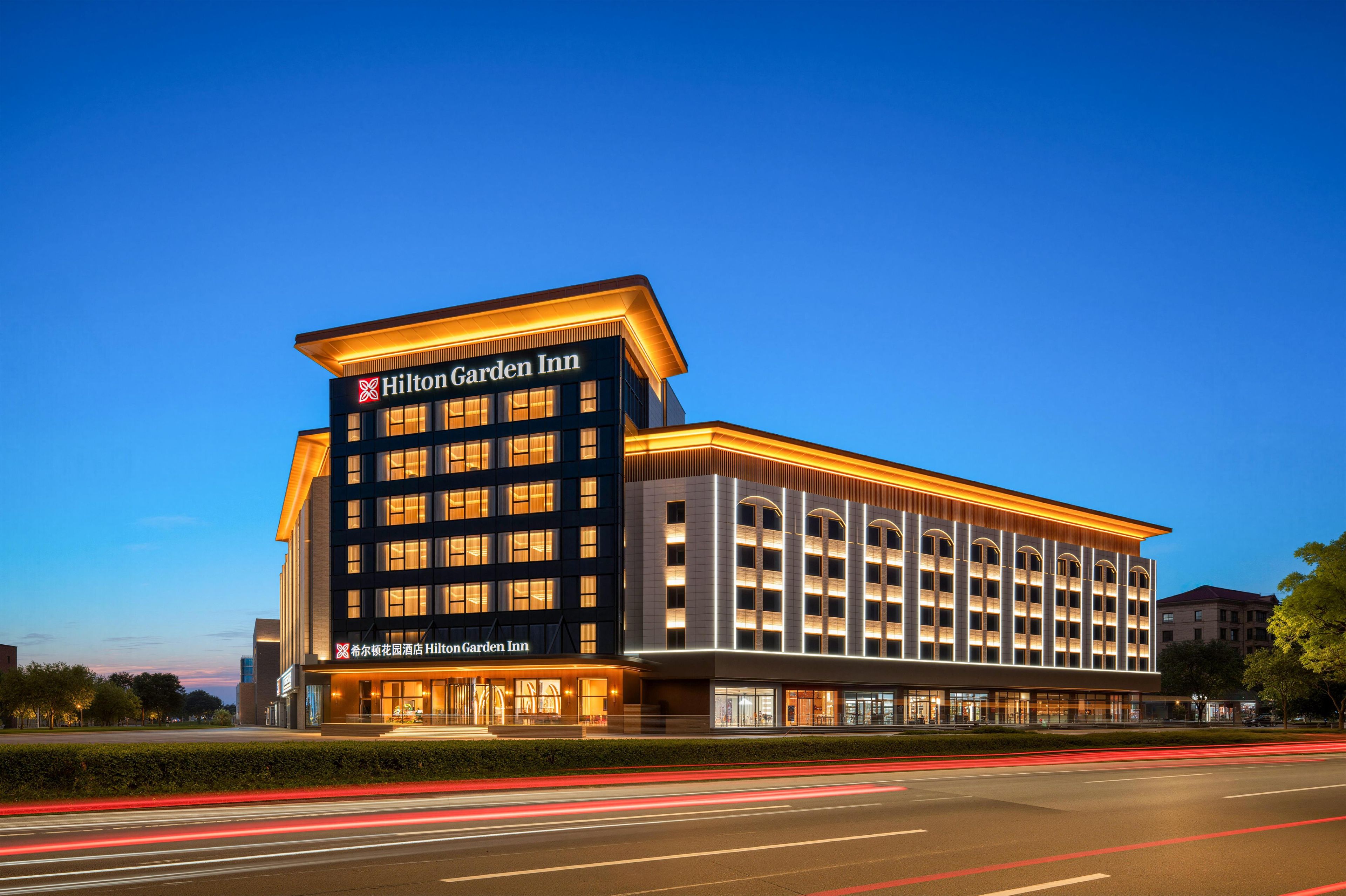 A modern Hilton Garden Inn hotel with a prominent entrance and multiple floors.