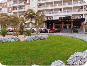A multi-story building with a sign reading 'TIBA GOLDEN RESORT' and 'RED SEA WAY' indicating the name and location. - Modern Studio Apartment With Stunning Red Sea Views (Hurghada)