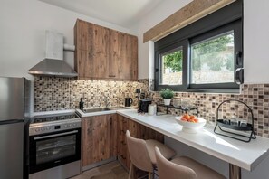 Apartment, Sea View | Private kitchen | Espresso maker, coffee/tea maker, full-size fridge, oven - Tholos Home Sfakia (Chora Sfakion)