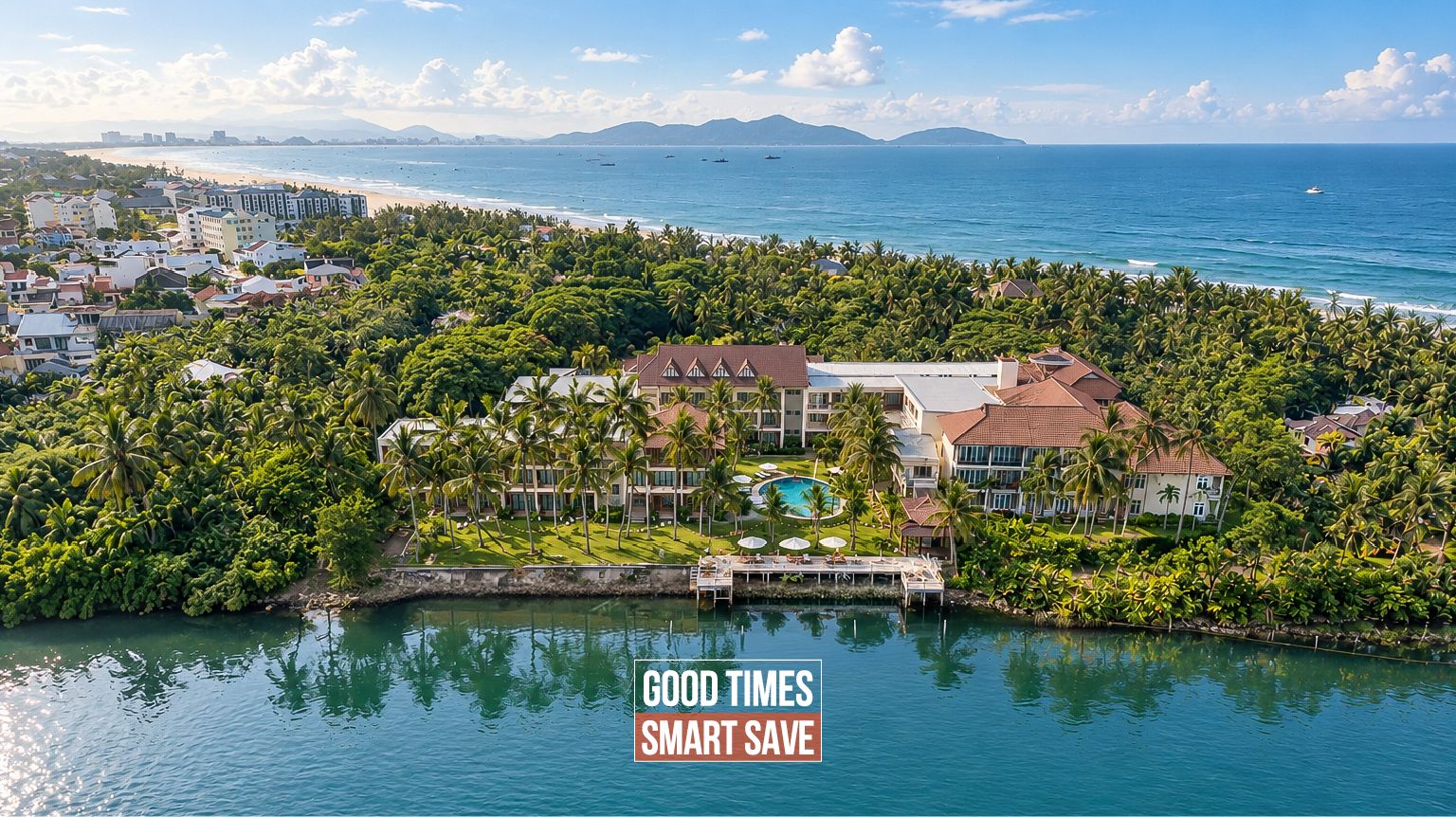 A coastal resort with a pool, beachfront view, and dense tropical vegetation.