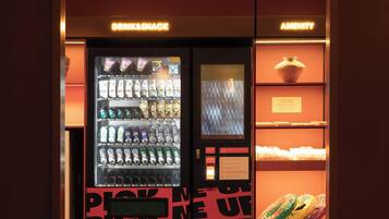 A vending machine area with drink and snack options, a digital screen, and a section labeled 'AMENITY'.