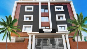 A multi-story building with a sign reading 'PALETTE Company Serviced'. - Palette Shree Jagannath Puri (Puri)