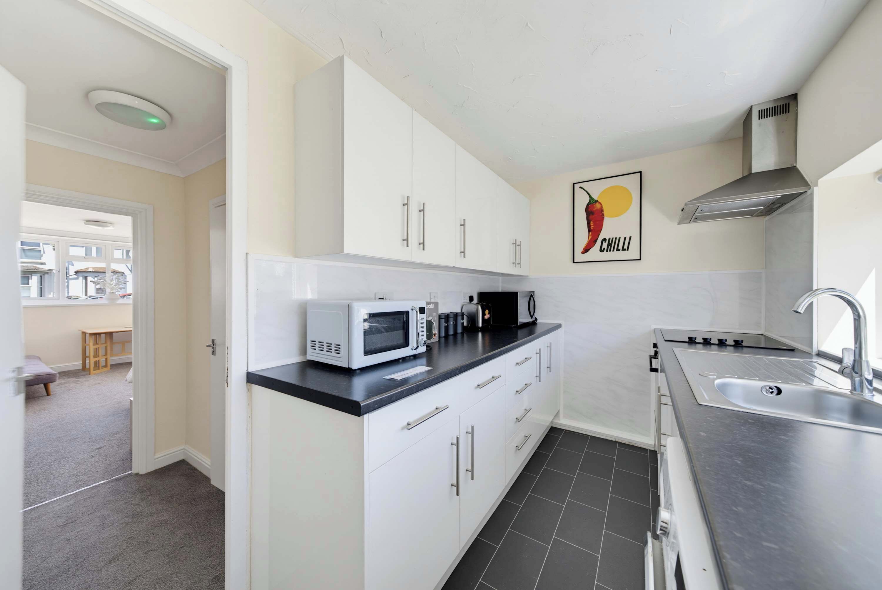 Coffee/tea maker, fridge, microwave, oven