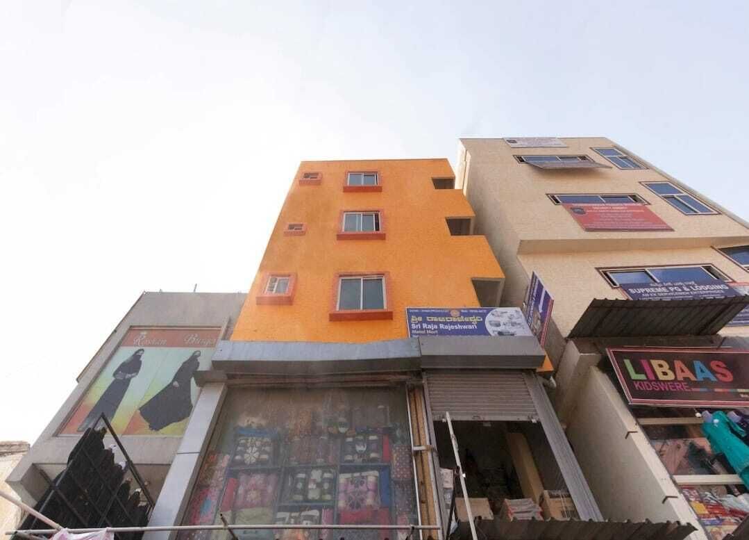 A multi-story building with a shop on the ground floor.
