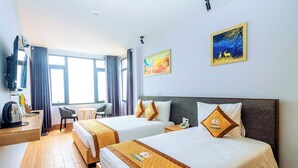 Quarto triplo luxo, vista para a praia
