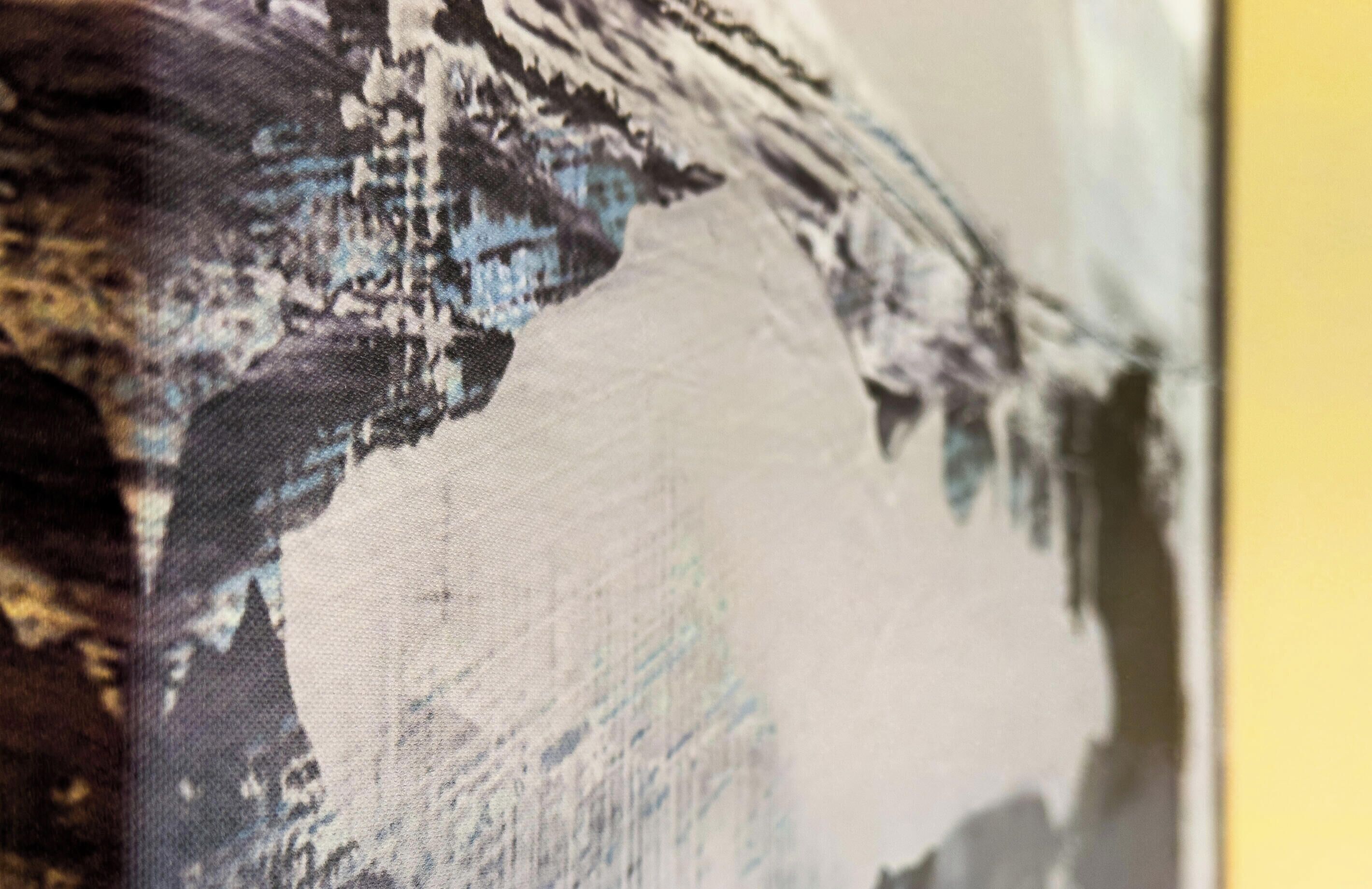A close-up of a textured wall with a pattern that includes blue and white elements.