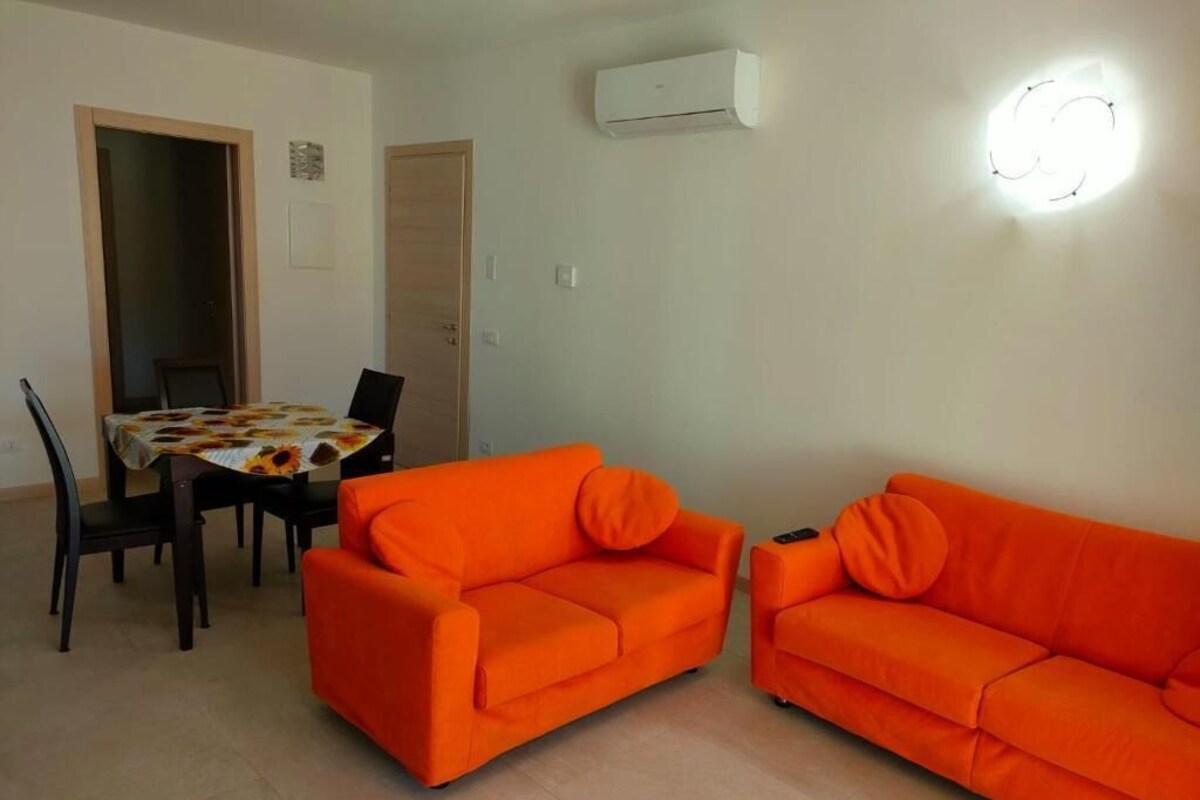 Departamento, vista al jardín | Área de sala de estar