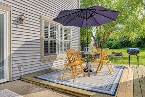 A patio with a table, chairs, and a grill. - 1 Mi to Eagle Creek Res: Family-friendly Indy Home (Indianapolis)
