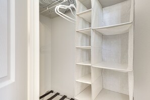 A white interior with a metal rack and white shelves. - Steps to Empire Polo Club: Casita w/ Pool Access (Indio)