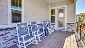 A covered outdoor seating area with benches and a stone wall. - Great for Families! Arvada Haven w/ Yard & Patio (Arvada)