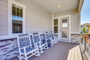 A covered outdoor seating area with benches and a stone wall. - Great for Families! Arvada Haven w/ Yard & Patio (Arvada)