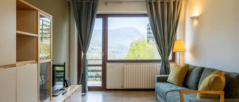 Apartment, 1 Bedroom, Balcony, Lake View | Living area | 30-inch TV with satellite channels