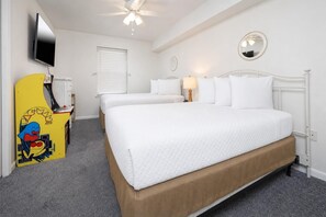 A hotel room with a bed, a TV, a ceiling fan, a window with blinds, and a bedside lamp. - Phoenix Vii 7501 3 Bedroom Condo (Orange Beach)