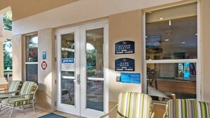 A fitness center with a pool area, game room, and lounge chairs outside. - Wh7754 - 6BR House With Pool Near Disney (Kissimmee)