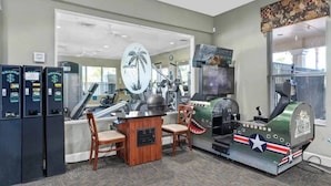 A room with exercise equipment, a desk, and chairs. - Wh7754 - 6BR House With Pool Near Disney (Kissimmee)