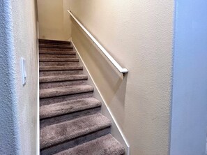A carpeted staircase with a handrail, leading to an upper floor. - Pp2904 - 6BR House With Pool Near Disney Parks (Kissimmee)