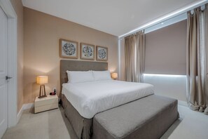 A neatly arranged bedroom with a bed, bedside tables, and a window with curtains. - Mvy7632 - 4BR House Near Disney (Kissimmee)