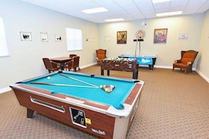 A pool table with a pool cue and balls, a smaller pool table, and two chairs. - Ow2819 - 2BR Apartment With Balcony Near Disney (Kissimmee)