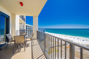 A balcony with a view of the beach and ocean. - Phoenix Vii 71414 1 Bedroom Condo (Orange Beach)