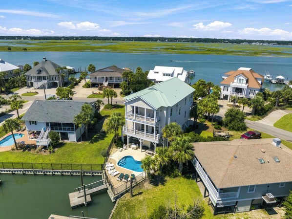 A residential area with houses, a swimming pool, and a dock. - High Cotton: Inlet Views, Private Dock, Pool & Easy Beach Access (Murrells Inlet)